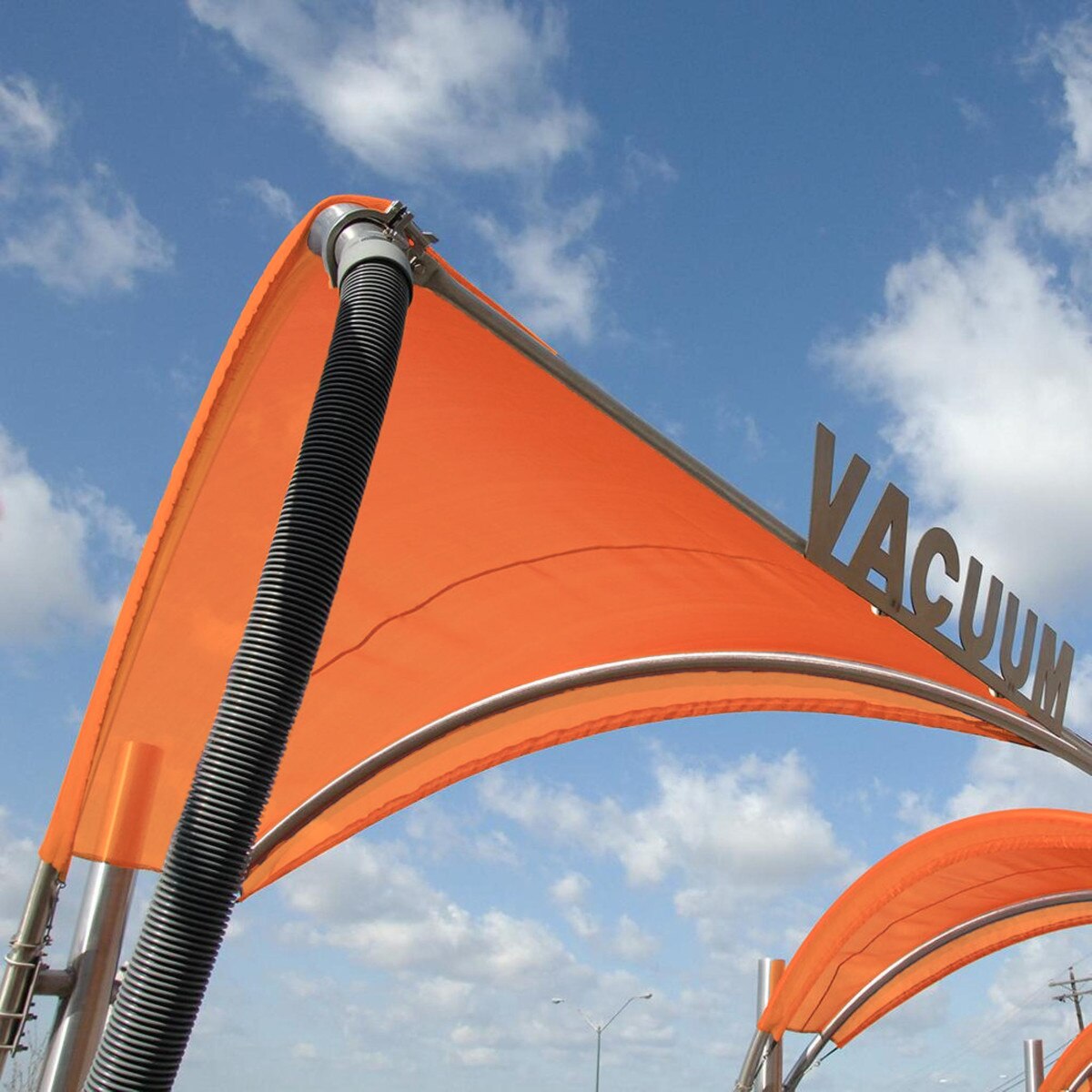 orange Tommy Car Wash vacuum canopy